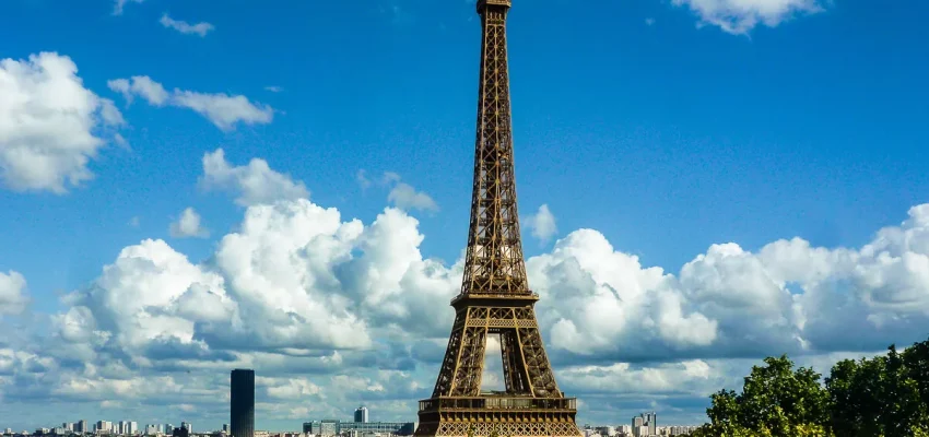 x1200-eiffel-tower-trees-cityscape.jpg.pagespeed.ic.ncH8sDWwuI